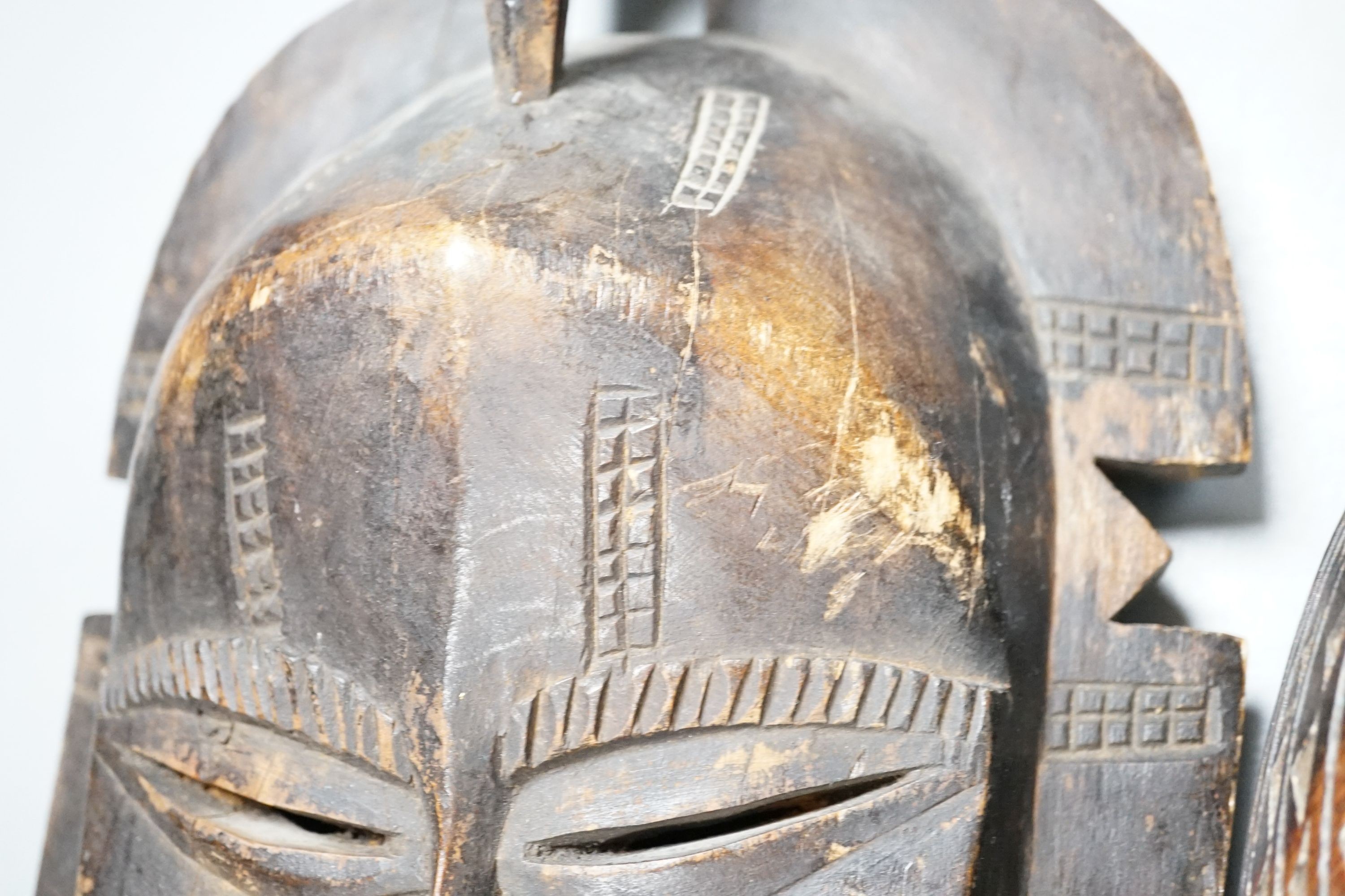 Two African carved wood masks; Senufo and Baule 65cm